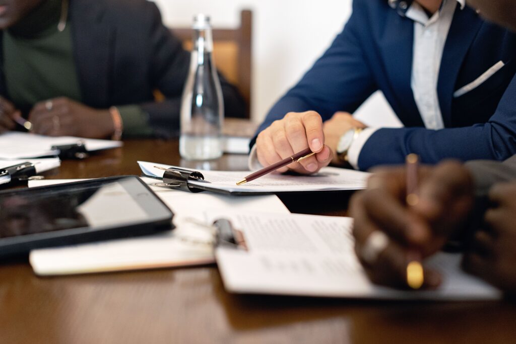 Bank representative reviewing guarantee documents for an industrial project